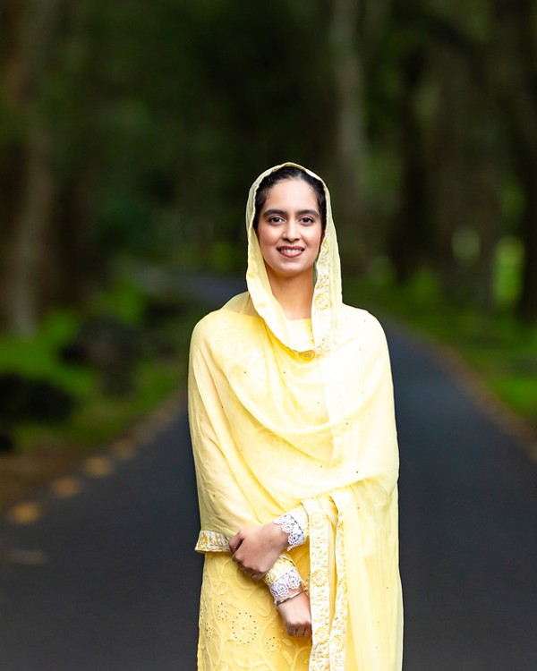 Amrita Kaur Ji in yellow chunni and traditional attire, captured by Lion Beats in natural sunlight.